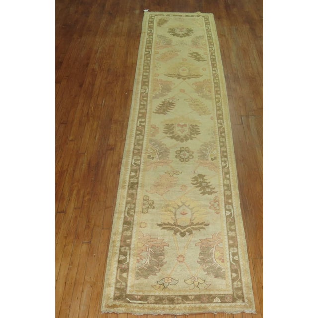 Turn of the 21st century Turkish Oushak runner predominantly khaki and brown. Handmade with recycled vegetable dyed wool...