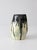 A striking vintage studio pottery vase with an organic, softly undulating form and an expressive forest-green drip glaze...