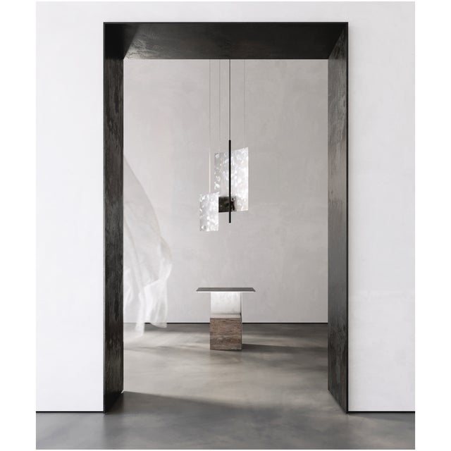 Svitlotin collection: where light meets shadow. These elegant curved pendant lights feature premium satin stainless steel...