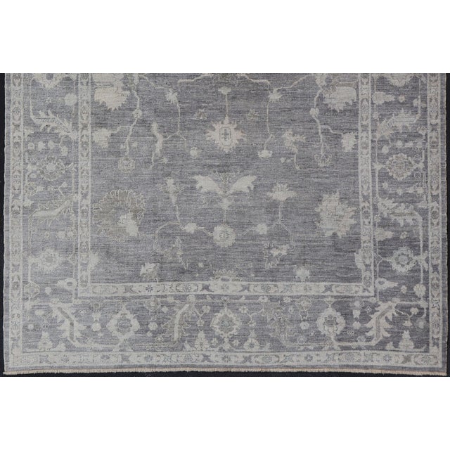 Measures: 9'11 x 13'3 Turkish Angora Oushak Rug in Slate Gray with Ivory Botanical Motifs 9'11 x 13'3. Keivan Woven Arts....
