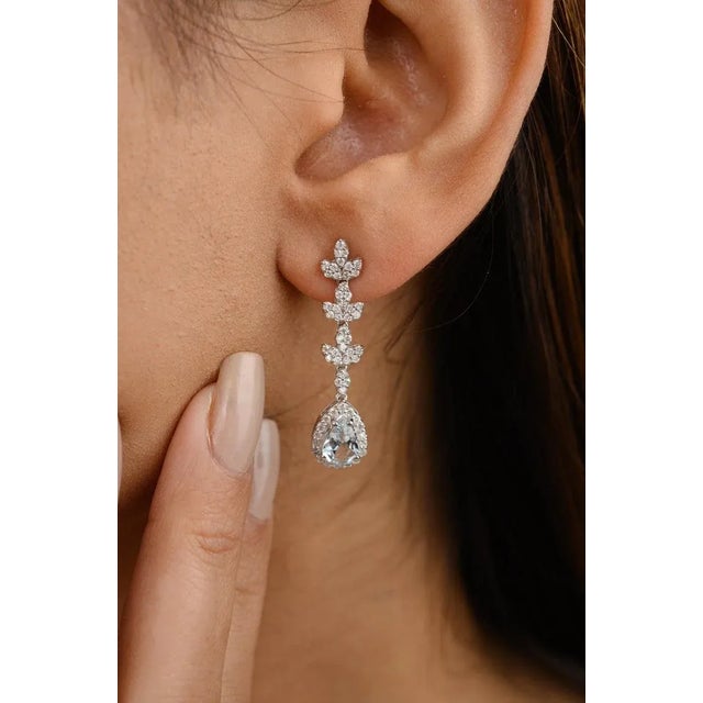 This is part of Chairish’s Fine Jewelry assortment. Certified Aquamarine Diamond Long Dangle Earrings in 14K Gold to make...