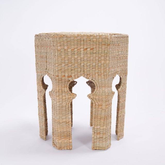 Standout Moroccan style table or stand handcrafted with a metal frame and expertly covered in woven reed in a hexagon form...