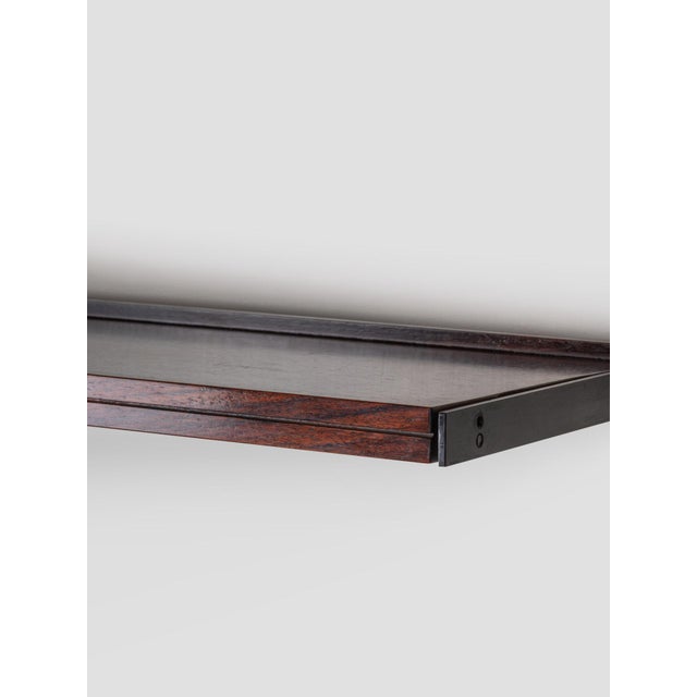 Osvaldo Borsani, large rosewood bookcase for Tecno, 1960s. The bookcase, originally designed as an office piece, is...