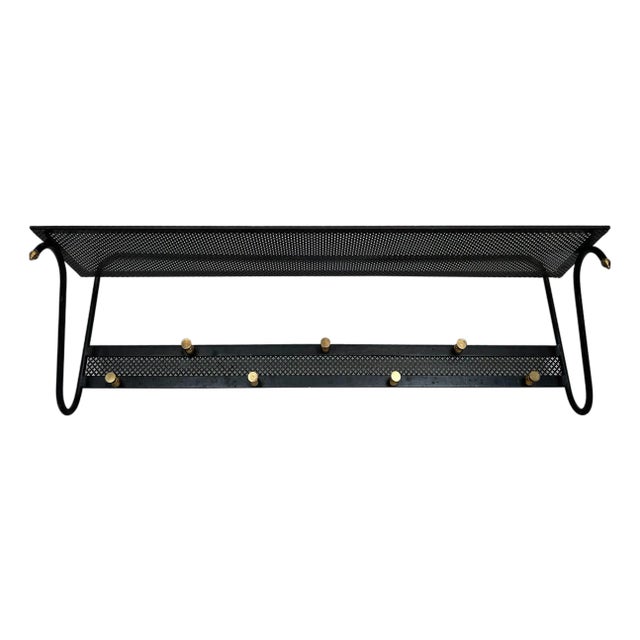 1950s Coat rack in black lacquered metal with perforated sheet metal and brass For Sale