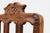 A graceful pair of carved oak side chairs from 18th‑century France, executed in the Régence style. Each chair features a...