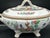 A striking hand painted Indiana Tree–style porcelain tureen featuring richly detailed florals, a central tree vignette,...