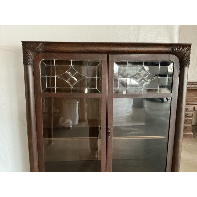 This is a Victorian era bookcase with leaded glass doors from 1930-40. It has 4 shelves. Door has clasp to keep it closed....