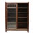 This antique Arts & Crafts Mission Oak bookcase, dating to approximately 1910, features a robust construction emblematic...