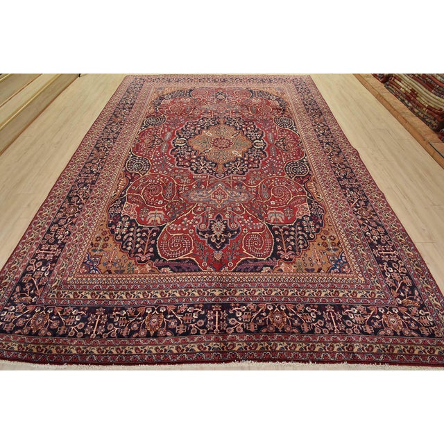 An authentic vintage traditional Mahvelat rug hand-knotted with fine wool and natural dyes. This oriental rug features a...