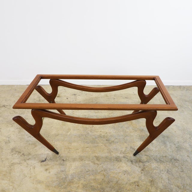 We offer this coffee table with the amazing and characteristic Attributed to Eugenio Escudero, made in México in mahogany...