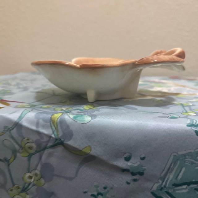 Enhance your collection with this charming mid-century modern ceramic trinket dish, skillfully sculpted in the shape of an...