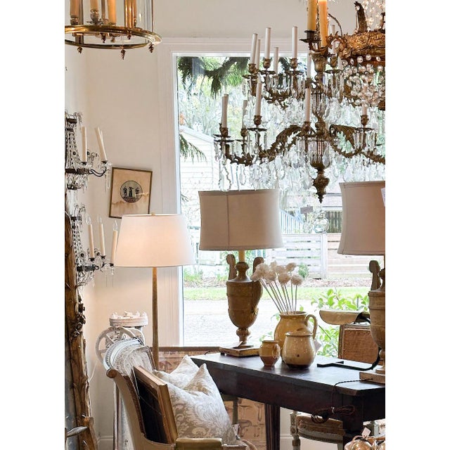 "Mourning Habits" depicts historical mourning attire worn by nobles of the period. The central circular vignette features...