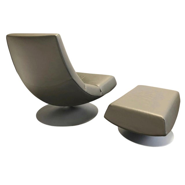 Beautiful Vintage 70's Modern Leather Swivel Lounge Chair and Swivel Ottoman. Grey Metal Bases. The ottoman measures 32' x...