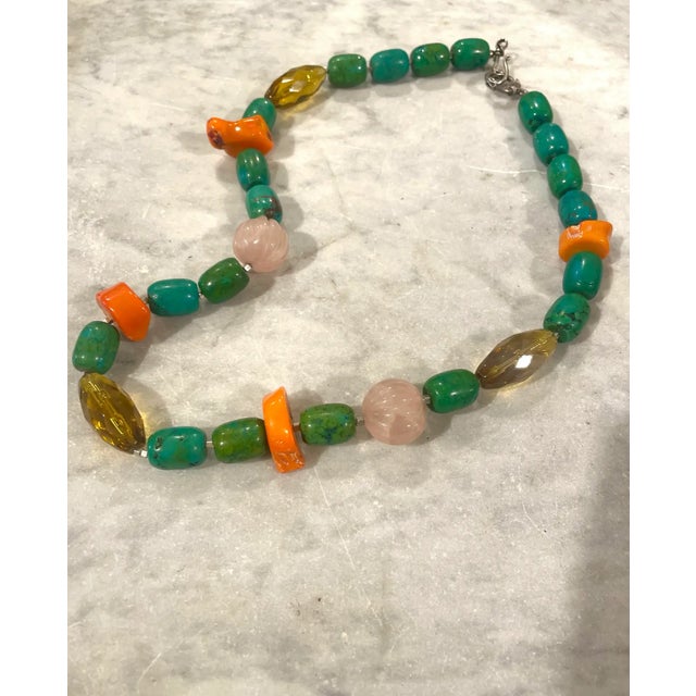 Channel your inner bohemian goddess with this stunning 18" beaded necklace featuring vintage turquoise, coral, and rose...