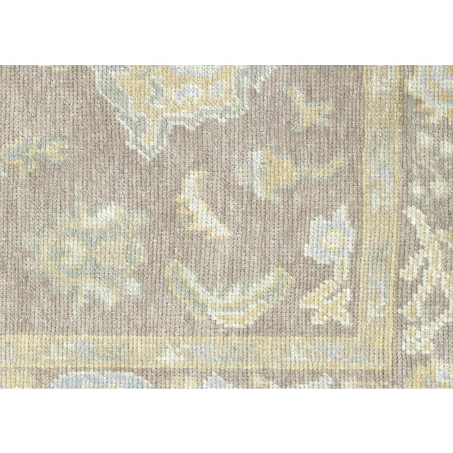 1990s Turkish Oushak Rug. Handwoven with wool on wool foundation in the Oushak region of Western Turkey. The Anatolian...