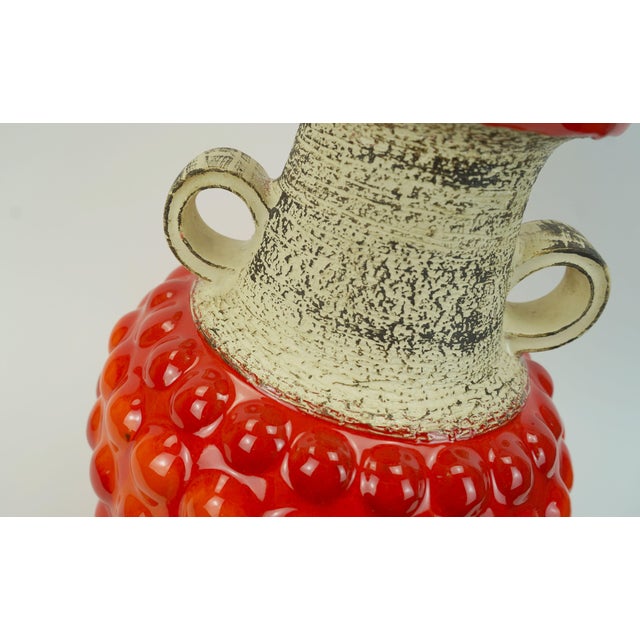 Fantastic vintage west german ceramic vase manufactured by Bay Keramik in the 1960s. Bubble surface with shiny red and...