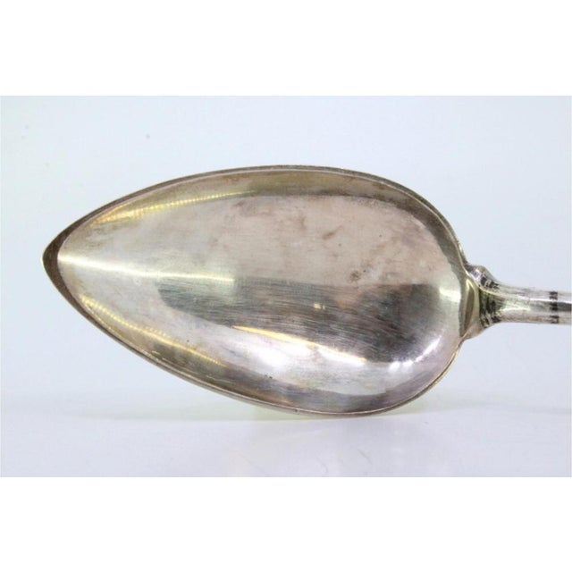 Silver Rice and Serving Spoon, in Very Good conditions. Designed 1890 to 1919 This piece has an attribution mark, I am...