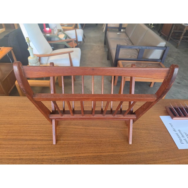 This classic Danish modern style magazine rack features solid teak construction with clean, architectural lines. Designed...