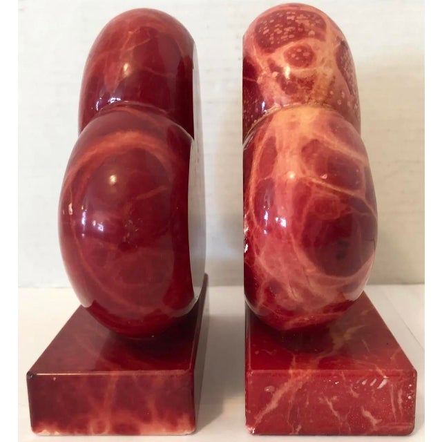 Cool and beautiful red alabaster heart shaped bookends. Original sticker on bottom. Hand carved and made in Italy....