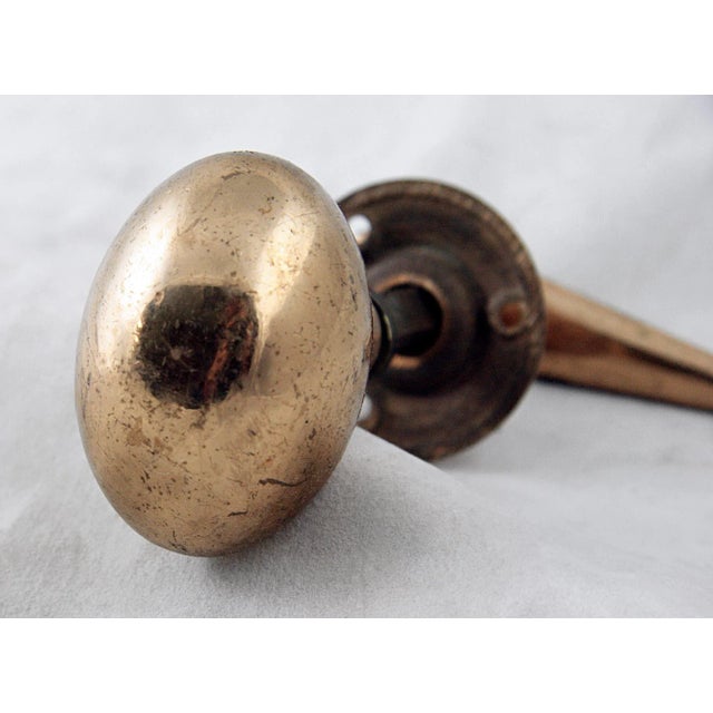 Set includes one brass knob, one lever knob, one rosette and a spindle. This is an Art Deco style of design that was...