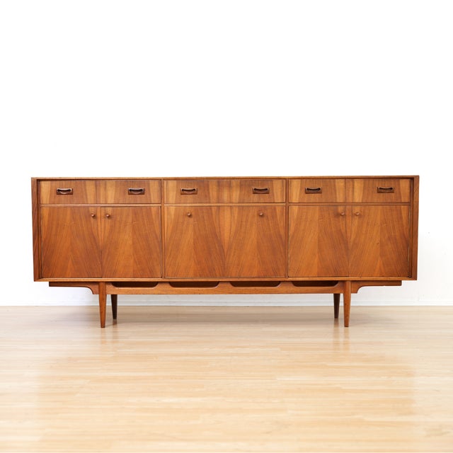 This vintage credenza was produced by McIntosh Furniture of Kirkcaldy Scotland during the 1960s. Produced in striking...