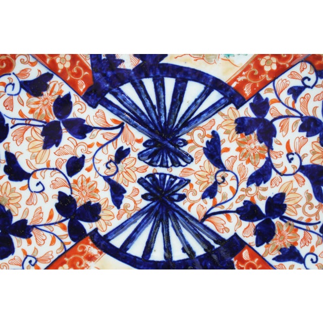 Circa 1860s double fan motif & shape Imari chop plate, Japan. The shaped bold boldly decorated with rich cobalt tendrils &...