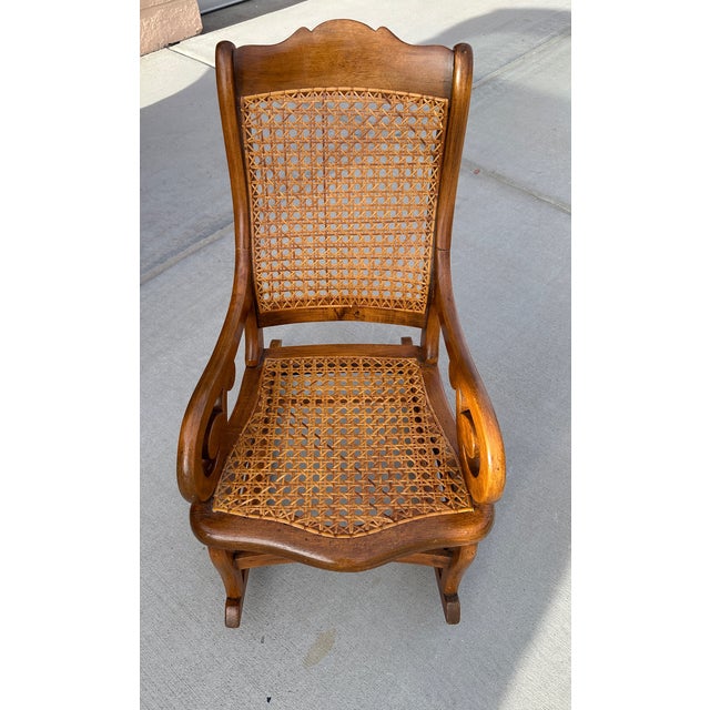 Antique American Children's Cane Rocking Chair. Super cute for a kids room or play room Solid wood with cane seat and...