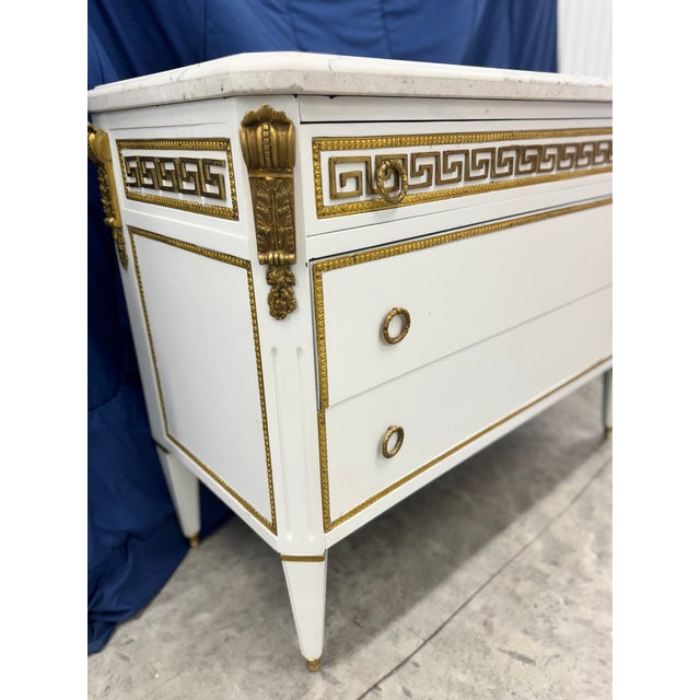 One of two available beautiful white marble top wood French Louis XVI Directoire chests commodes in the style of Jansen...