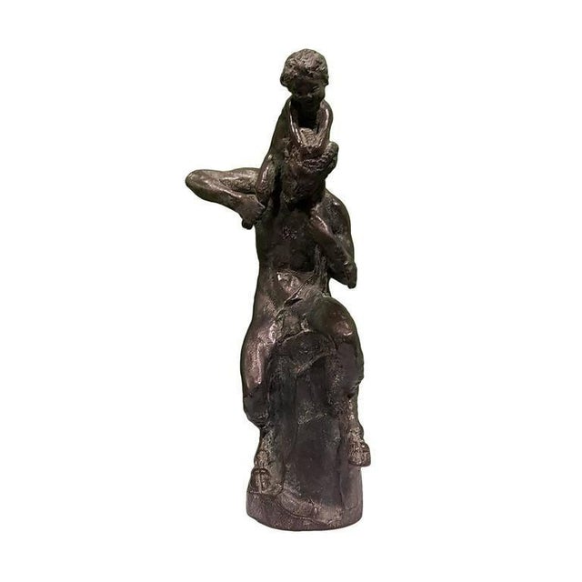 Satyr sculpture with a little faun on his shoulders, signed and numbered by Mistruzzi. The sculpture belongs to an edition...