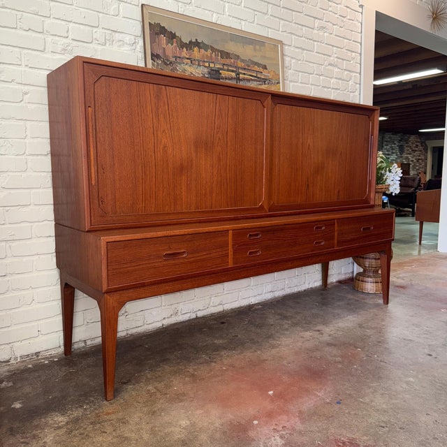 Vintage mid-century Danish modern teak highboard designed by Scandinavian legend Kai Kristiansen for manufacturer Schou...