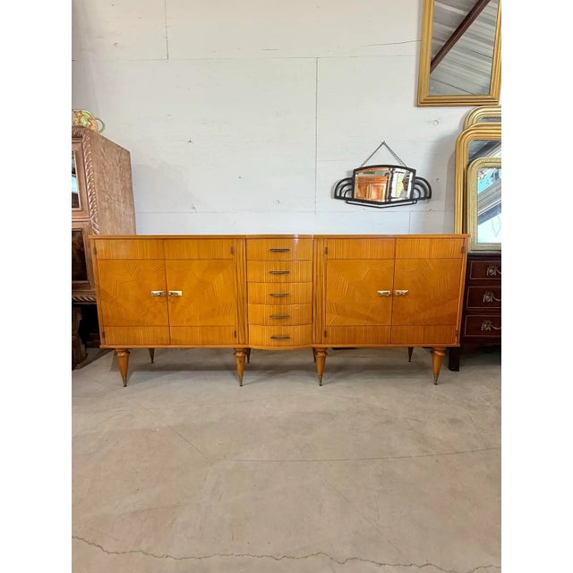 French art deco ''Sunburst'' sideboard. The sideboard is in very good condition, 4 doors sideboard, five center drawers...