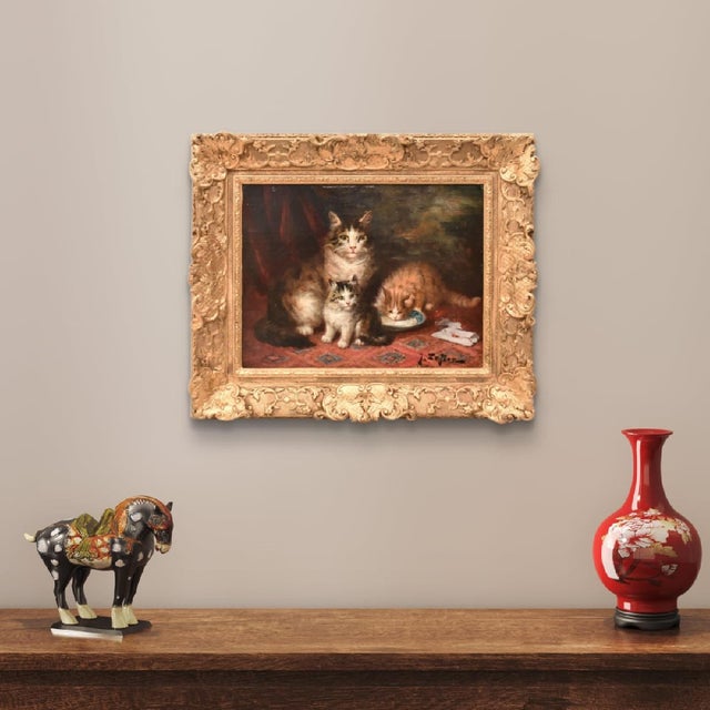 The category of Antique Cat Portrait Paintings presents a charming interior scene with three felines, captured in a moment...