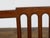 A pair of English George III period plank seat chairs from circa 1800 with pierced backs, slightly scrolling arms,...