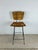 This mid century modern bar stool in the style of Arthur Umanoff features bentwood seat and back with original finish atop...