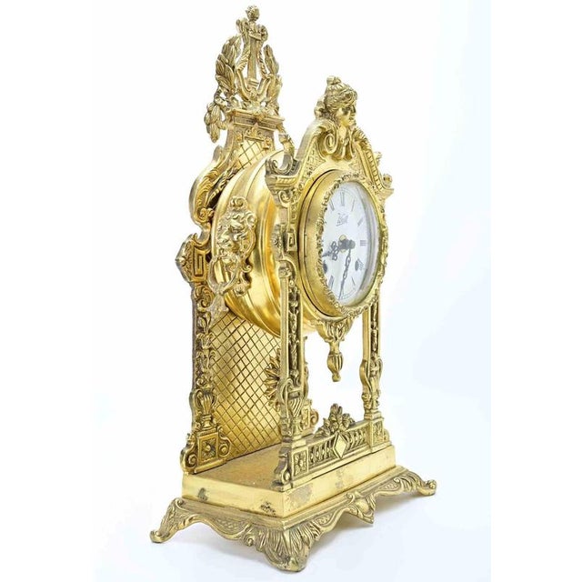 Antique French Napoleon III "Portico" clock and pendulum. Inlaid wood, metal and bronze. Very good and working condition.