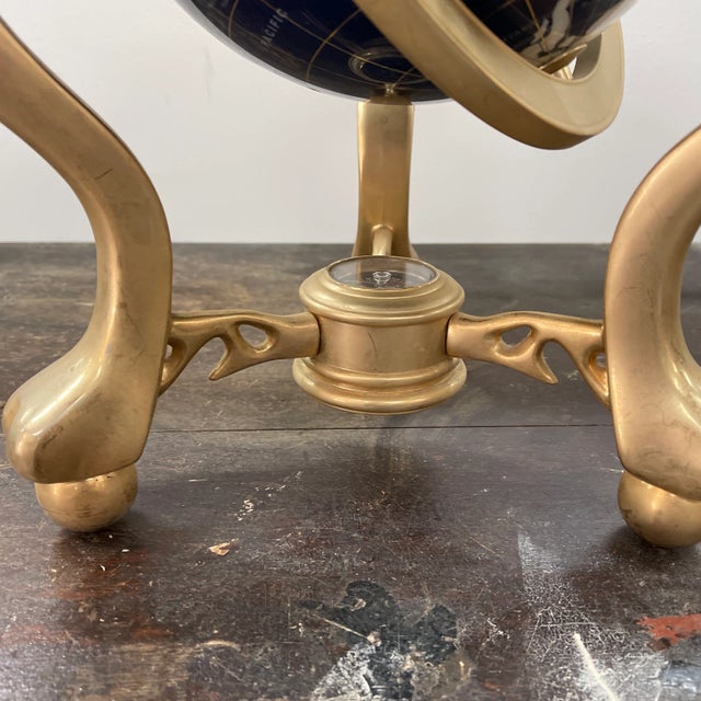Piece is in great condition. The globe has beautiful colors. The brass base shows a little wear due to age. Overall piece...