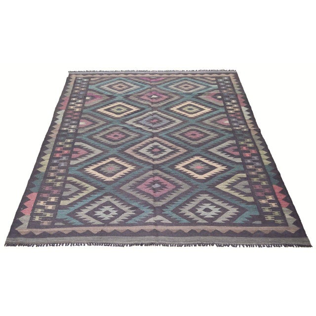 Flatweaved with care using traditional rug-making techniques, this wool rug blends timeless craftsmanship with a modern...