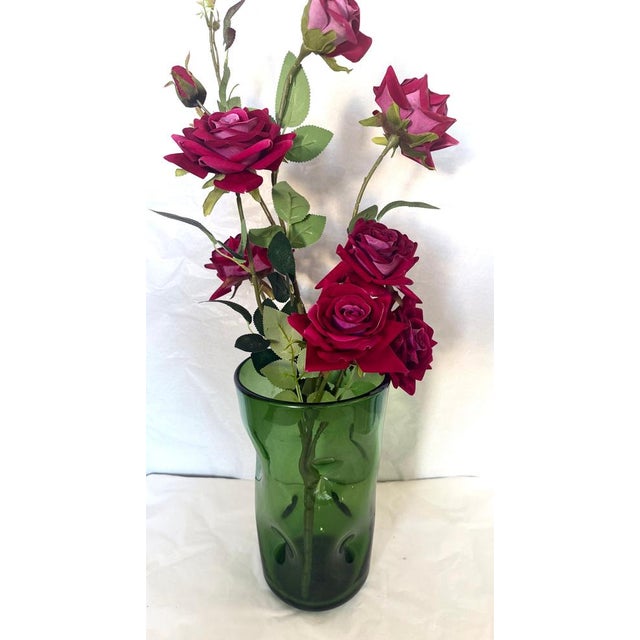 Made in Italy by "Vetrerie Empolesi", 1950-1955. It is made of green hand-blown glass, in Empoli. This vase is published....