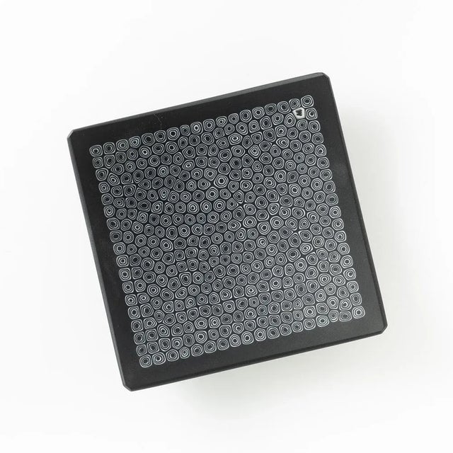 Murano glass plate made by melting together sections of glass rods in a furnace, with each section depicting a small...