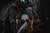 This artwork presents a serene glimpse into the heart of a gnarled tree, where a delicate sphere reflects a tranquil sky,...