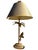 This striking sculptural table lamp features a detailed tropical bird perched alongside a tall palm tree, surrounded by...