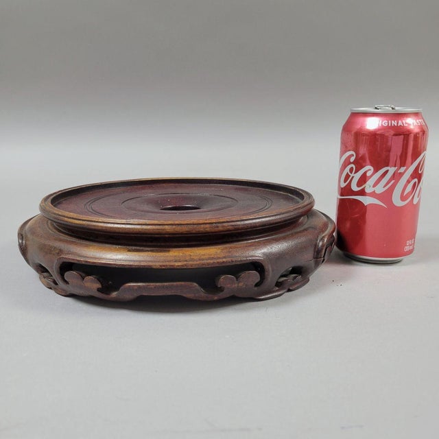 10" Chinese rosewood toned round display stand with an 8" interior surface. If the base of your object is 8", this would...