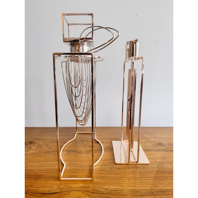 Minimalist factices of modern form perfume bottles. They offer a geometric cast shadow and also a fine example of negative...