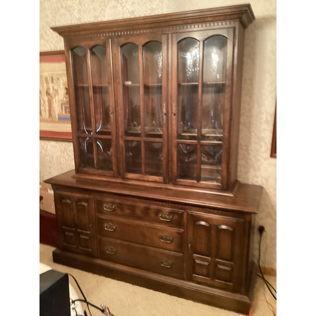 This well preserved 1970’s Ethan Allen timeless classic lighted maple China cabinet/hutch enhanced our living room since...