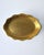 An oval scalloped edge porcelain jewelry dish with a hand-decorated rich gold finish of embossed flower design, circa mid...
