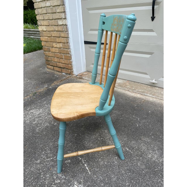 This solid maple Windsor chair features bamboo-style legs, spindles, and stretchers. It closely resembles the Windsor...
