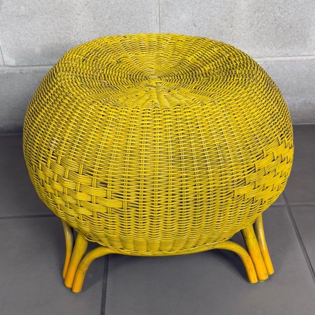 A vibrant and versatile circular floor stool ottoman, handcrafted from wicker and wicker woven on a sturdy rattan cane...