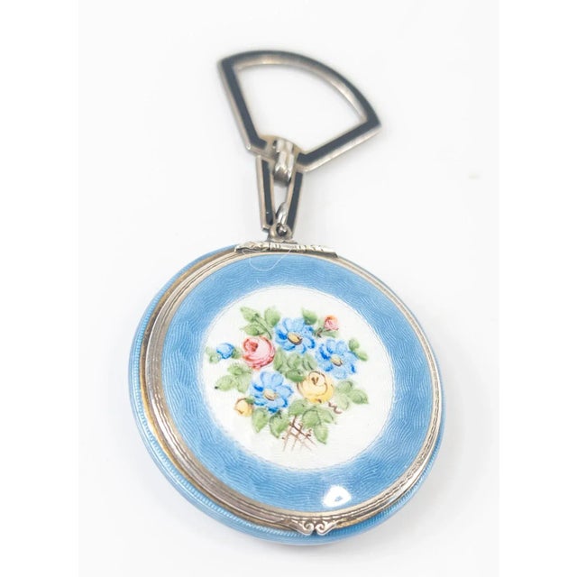 We are selling this very pretty baby blue and floral decorated guilloche enamel compact on a sterling silver body. The...