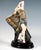 Rare viennese art déco ceramic figurine: young, pretty dancer with blonde, curly hair posing in a short, see-through...