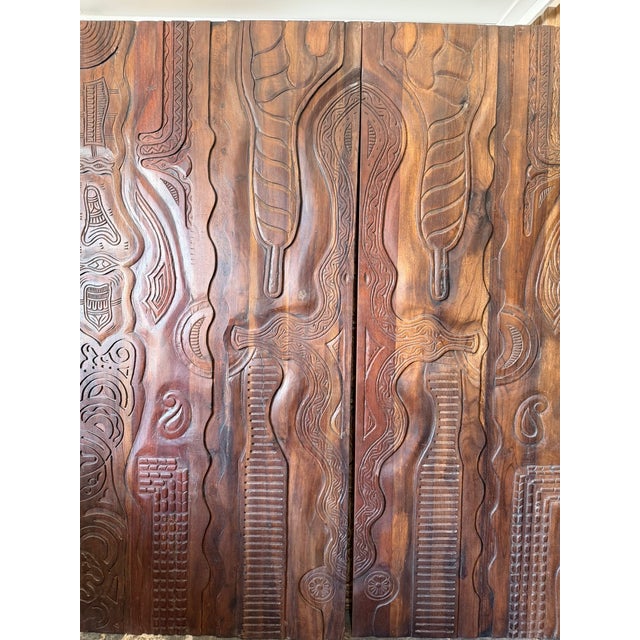 Infused with heritage and artisanal depth, this vintage brown barn door showcases intricate tribal hand-carved detailing...